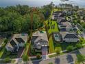 Aerial view of a luxury home with pool on a large lot backing up to a lake at 10219 Atwater Bay Dr, Winter Garden, FL 34787