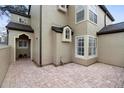 Brick paved patio adjacent to the townhome, featuring a private entrance at 110 Becket Ln, Lake Mary, FL 32746