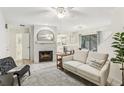 Living room with a fireplace, comfy seating, and access to the kitchen at 1120 Portland Ave # 4, Orlando, FL 32803