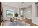 Spacious home office with built in shelving and large window at 13415 Laxness St, Orlando, FL 32827