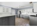 Modern kitchen with stainless steel appliances and an island at 1423 Grand Cayman Cir, Winter Haven, FL 33884