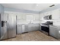 Modern kitchen with stainless steel appliances and granite countertops at 1423 Grand Cayman Cir, Winter Haven, FL 33884