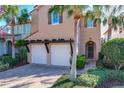 Two-story house with two-car garage, landscaping, and a walkway to the front door at 16324 Vetta Dr, Montverde, FL 34756
