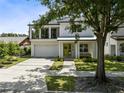 Modern two-story house with a green door and spacious driveway at 2315 Depauw Ave, Orlando, FL 32804