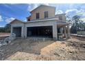 Under-construction two-story home showing the framing and garage blockwork under a sunny sky at 5238 Prairie Preserve Run, St Cloud, FL 34772