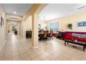 Bright dining room with a wooden table and six chairs at 590 Michigan Estates Cir, St Cloud, FL 34769