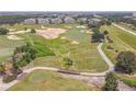 Golf course with scenic landscaping and water features at 7609 Heritage Crossing Way # 201, Reunion, FL 34747