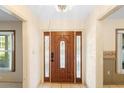 Front entrance with wood door and decorative glass at 847 Lake Charm Dr, Oviedo, FL 32765