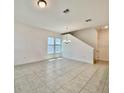 Spacious dining room with tile floors and plenty of natural light at 10432 Austrina Oak Loop, Winter Garden, FL 34787