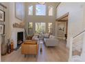 Living room featuring a fireplace and ample natural light at 10483 Kristen Park Dr, Orlando, FL 32832