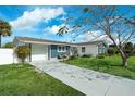 Front view of a remodeled home with a driveway and attached garage at 1203 Marlowe Ave, Orlando, FL 32809