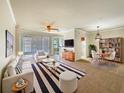 Spacious living room with ample natural light and stylish furnishings at 1214 Romani Ave # 10240, Davenport, FL 33896