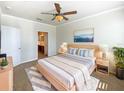 Bright and airy main bedroom with ensuite bathroom access at 1214 Romani Ave # 10240, Davenport, FL 33896