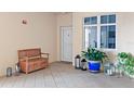 Inviting entryway with tiled floor and potted plants at 263 Minorca Beach Way # 301, New Smyrna Beach, FL 32169