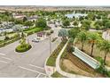 Inviting community entrance with lush landscaping, a water feature, and a manned security gate ensuring privacy at 8833 Corcovado Dr, Kissimmee, FL 34747