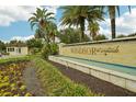 Gated community entrance with water feature and landscaping at 8833 Corcovado Dr, Kissimmee, FL 34747