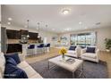 Open floor plan boasts a modern kitchen island and Gathering room with water views at 8833 Corcovado Dr, Kissimmee, FL 34747