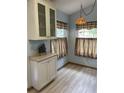 White cabinets and a light blue wall in a kitchen nook at 89 Crooked Pine Rd, Port Orange, FL 32128