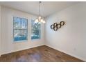 Bright dining room with hardwood floors and large windows at 15508 Blackbead St, Winter Garden, FL 34787