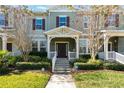 Townhome exterior featuring a front porch and walkway at 15508 Blackbead St, Winter Garden, FL 34787