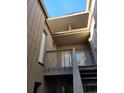 Exterior condo stairs leading to a private entrance with a balcony at 203 Crown Oaks Way # 202, Longwood, FL 32779