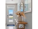 Bright and airy entryway with console table, mirror, and pampas grass at 2183 Longleaf Rd, Davenport, FL 33837