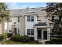 Front view of charming townhome with green door at 430 Southern Pecan Cir # 207, Winter Garden, FL 34787