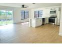 Modern kitchen with stainless steel appliances and island at 4658 Kirkland Blvd, Orlando, FL 32811