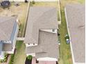 Aerial view of a two-story house with gray roof shingles at 494 Amadoras Way, St Cloud, FL 34771