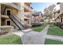 Landscaped grounds with walkways between apartment buildings at 5961 Westgate Dr # 2034, Orlando, FL 32835