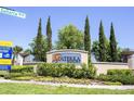 Solterra Resort entrance sign with lush landscaping at 7530 Oak Spring Ln, Davenport, FL 33837