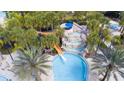 Aerial view of resort pool with waterslide and spa at 7530 Oak Spring Ln, Davenport, FL 33837