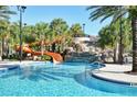 Resort-style pool with a waterslide and waterfall feature at 7530 Oak Spring Ln, Davenport, FL 33837