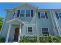 Front view of light blue townhome at 8923 Shine Dr, Kissimmee, FL 34747
