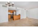 Kitchen with wood cabinets, granite countertops, and stainless steel appliances at 90 Moree Loop # 15, Winter Springs, FL 32708