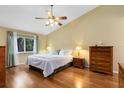 Bright bedroom with hardwood floors and ceiling fan at 1107 Pheasant Cir, Winter Springs, FL 32708