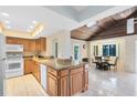 Spacious kitchen with granite countertops and island at 1107 Pheasant Cir, Winter Springs, FL 32708