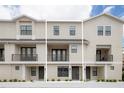 Three-unit townhome building with contemporary design at 12964 Brandon Coates Dr, Orlando, FL 32828