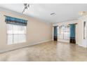 Large living room featuring tile floors and lots of natural light at 15319 Stonebriar Way, Orlando, FL 32826