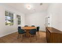 Dining room with a round wooden table and dark green chairs at 15944 Citrus Knoll Dr, Winter Garden, FL 34787