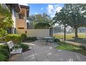 Outdoor patio space with seating and lush landscaping at 1812 Turnberry Ter, Orlando, FL 32804