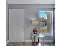 Inviting entryway featuring modern floors and natural light from the front window at 1834 Roper Rd, St Cloud, FL 34771