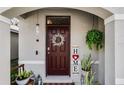 Inviting front door with wreath and home decor at 325 Pelham Park Dr, Deland, FL 32720