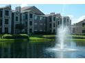 Apartment complex with a water fountain at 5545 Devonbriar Way # 205, Orlando, FL 32822