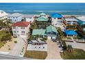 Aerial view of beach house community near the ocean at 6111 Turtlemound Rd, New Smyrna Beach, FL 32169