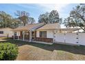 One-story home with attached carport and landscaping at 6616 Nw 60Th St, Ocala, FL 34482