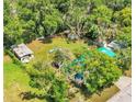 Aerial view showing the house, large backyard, and surrounding landscape at 750 S Dudley Ave, Bartow, FL 33830