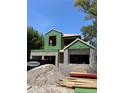 Two-story home under construction featuring zip system sheathing and concrete block walls on a sunny day at 785 N Phelps Ave, Winter Park, FL 32789