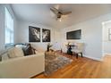 Bright living room with hardwood floors, comfy seating, and stylish decor at 805 Weldona Ln # 104, Orlando, FL 32801