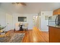 Open living area with hardwood floors, a small table and chairs and neutral color scheme at 805 Weldona Ln # 104, Orlando, FL 32801